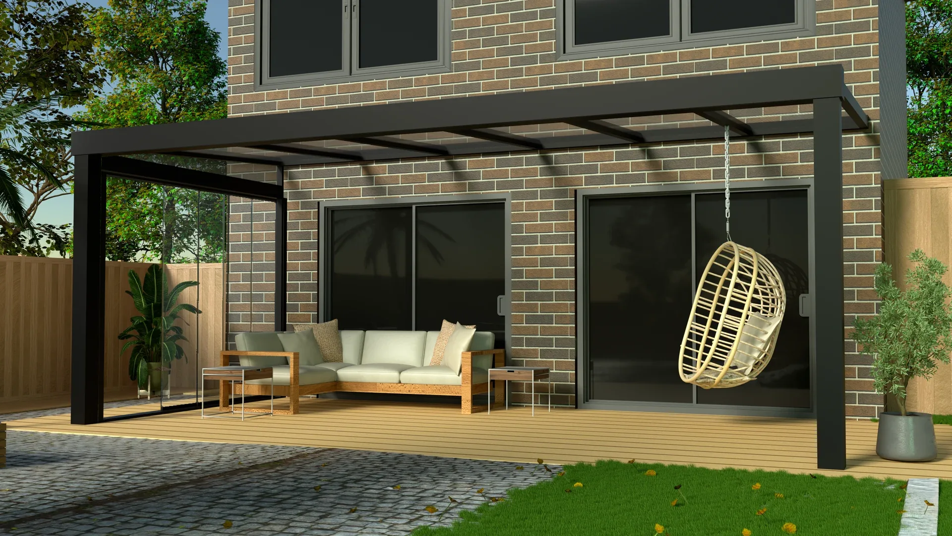 Antraciet aluminium veranda met glazen dak en glazen schuifwand aan een bakstenen woning
